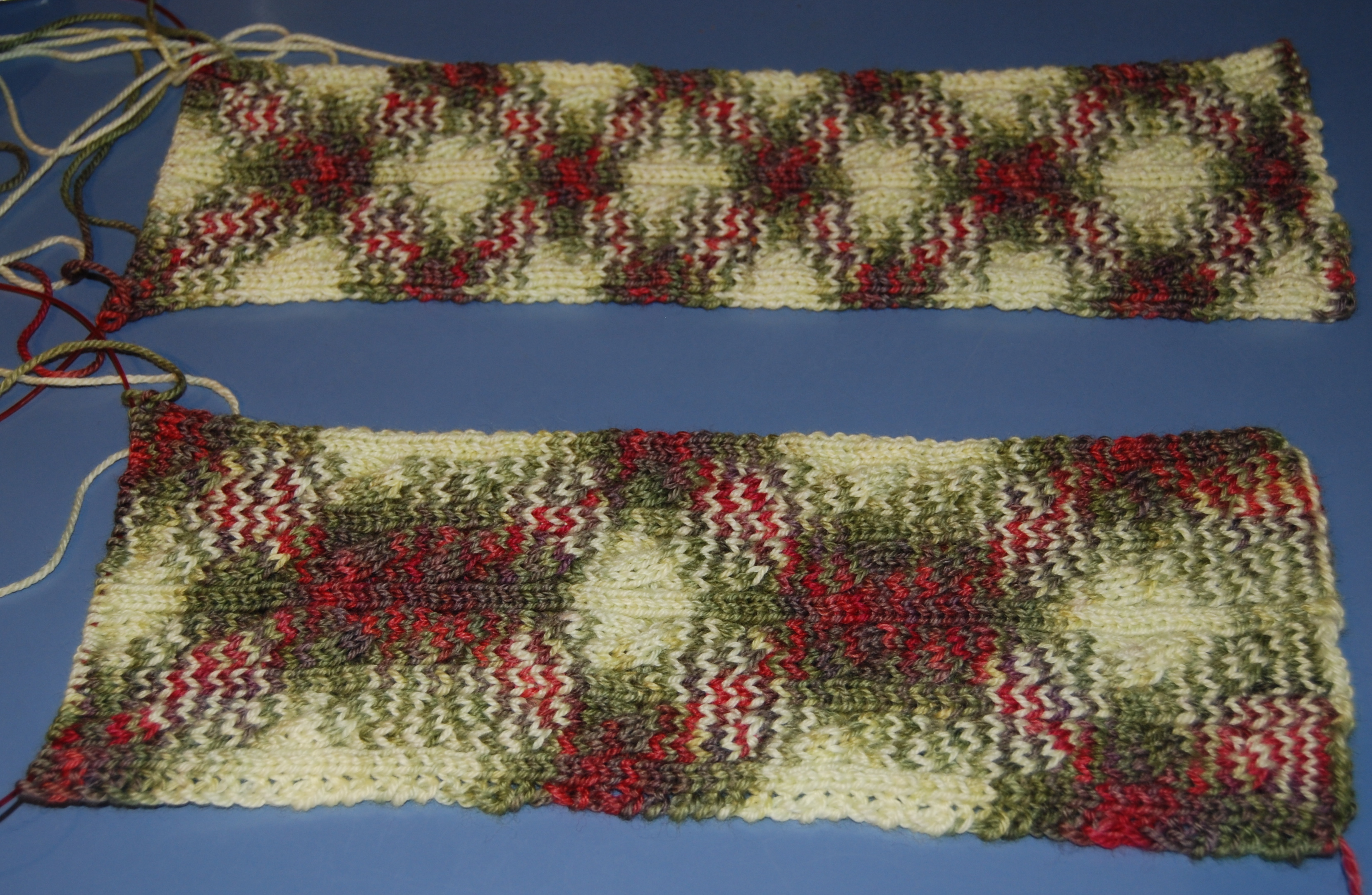 top: palindrome, US4, 52 stitches bottom: irish hiking scarf, US4, 54 stitches